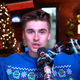 Ludwig Ahgren appears in a Christmas sweater after being banned from YouTube.